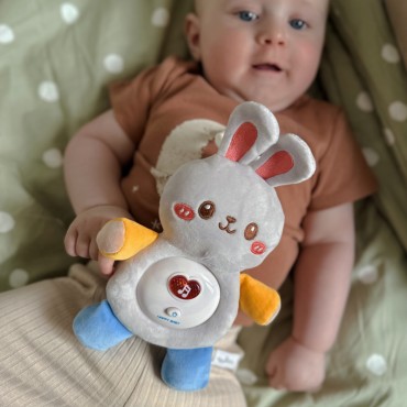 WOOPIE BABY Interaktyvus pliušinis kūdikio minkštutis su šviesos garsu zuikis miegmaišis rožinis